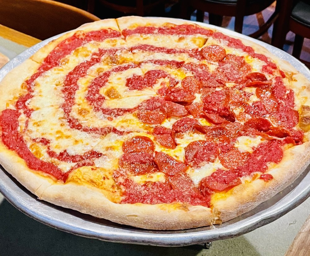 A pepperoni pizza on a tray.